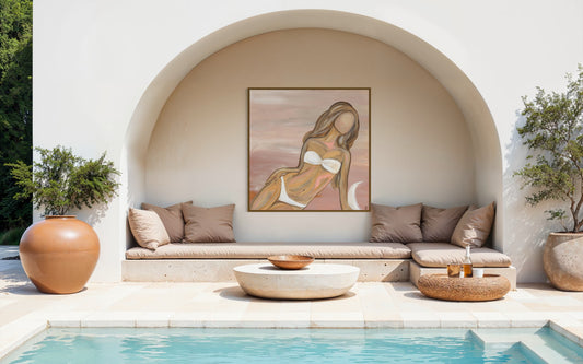 Outdoor seating area with a pool, decorative wall art, and potted plants.